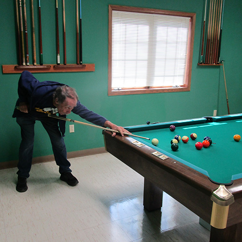 Man shooting pool